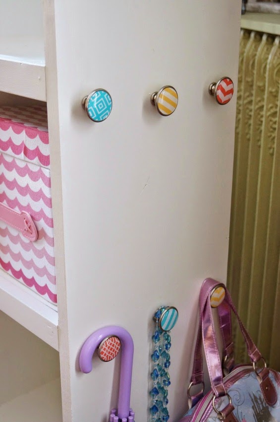 Don't you just love those custon knobs on the side of this unit for hanging cute dress up gear?